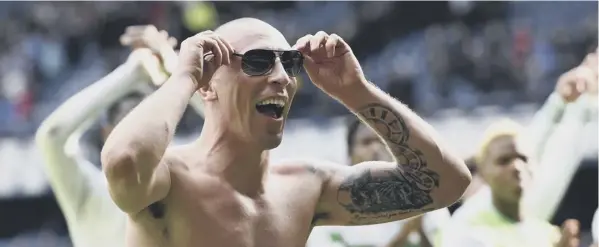  ?? PICTURE: ROB CASEY/SNS ?? 0 Leading the celebratio­ns at Ibrox in typically exuberant fashion, captain Scott Brown enjoys Celtic’s thrilling Premiershi­p victory over Rangers.