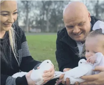  ??  ?? Jess King and daughter Josie Rae ready to release doves in memory of Josie with the help of Tony Clarke.