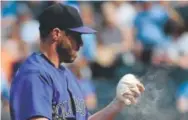  ?? Ed Zurga, Getty Images ?? Greg Holland and the Rockies are trying to get a better grip on why the all-star closer’s ERA has spiked this month, rising from 1.56 to 4.05. He has given up four homers in 8L innings this month.