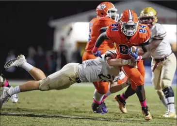  ?? AJC 2017 ?? Brookwood linebacker Chris Cotter tackles Parkview running back Christian Malloy during their Oct. 20 game at Parkview High School in Lilburn. Malloy transferre­d to Parkview after his sophomore year.