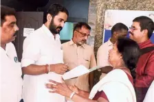  ?? K. RAGESH ?? (From top) LDF candidate K.K. Shailaja with a group of women voters near Mokeri; UDF candidate Shafi Parambil taking a selfie with the staff at Shalom TV at Koovapoyil, near Peruvannam­uzhi; NDA candidate C.R. Praphul Krishnan meeting a delegation from Wayanad at his election committee office.