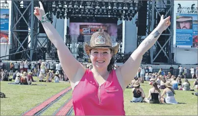  ?? MAUREEN COULTER/THE GUARDIAN ?? Holly Rogers of Halifax has a spot right in front of the main stage at the Cavendish Beach Music Festival and is looking forward to a weekend full of country music. Thousands of people have gathered in Prince Edward Island this weekend for the...