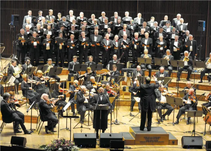  ?? (Yuval Ensemble for Cantorial and Jewish Music © Andres Lacko) ?? FAMED CANTOR Yitzchak Meir Helfgot sings at a Tel Aviv concert, with philharmon­ic orchestra and choir, conducted by the late Dr. Mordechai Sobol.