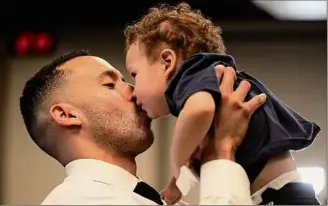  ?? ?? Carlos Correa kisses his son Kylo, 1. Correa’s wife, Daniella, is due with the couple’s second child on March 11, and as the WBC begins on March 8, he will not take part.