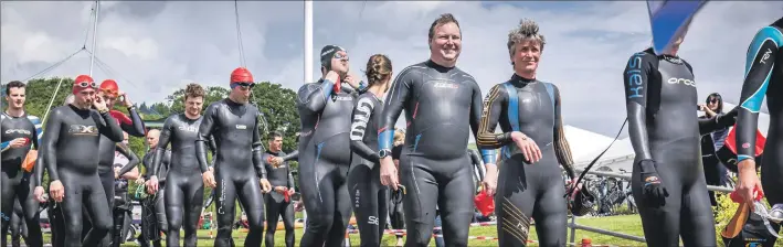  ??  ?? The swim competitor­s head for the rib to take them to Holy Isle.