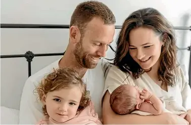  ??  ?? Michael Venus with daughter Lila, 2, wife Sally Trafford and baby Georgia. Venus left to chase an Olympic dream two weeks after Georgia was born.