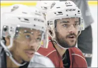  ?? FILE ?? Pascal Aquin, right, listens to a drill during a recent Charlottet­own Islanders practice.