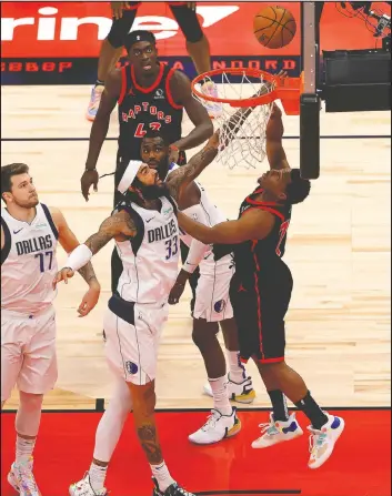  ?? — GETTY IMAGES ?? Raptors' Kyle Lowry (right) shoots over Dallas' Willie Cauley-Stein at Amalie Arena in Tampa last night. The Raptors won 116-93.