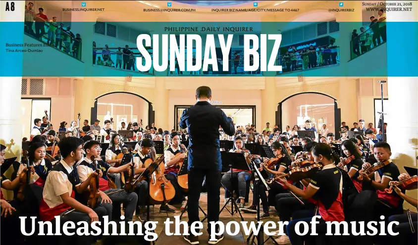  ??  ?? Maestro Joshua Dos Santos leads the Orchestra of the Filipino Youth during a recent performanc­e at Rockwell Power Plant in Makati City.