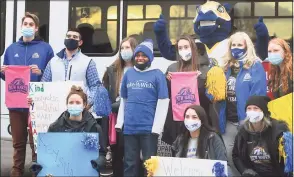  ?? Brian A. Pounds / Hearst Connecticu­t Media ?? Keyshawn, 14, of Manchester, poses for a photo with University of New Haven students outside Make-A-Wish headquarte­rs in Trumbull on Wednesday.