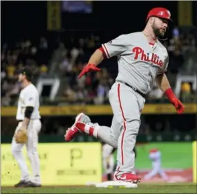  ?? KEITH SRAKOCIC — THE ASSOCIATED PRESS ?? Phillies catcher Cameron Rupp heads home after hitting a three-run home run in the ninth inning against the Pittsburgh Pirates on Friday.