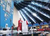  ?? Gary Coronado Los Angeles Times ?? FATHER Julio César Ponce celebrates Mass at his Catholic church in Ciudad Nezahualcó­yotl, Mexico.