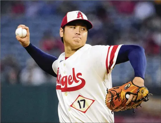  ?? MARK J. TERRILL/ASSOCIATED PRESS ?? Shohei Ohtani, the American League MVP in 2021 and the runner-up last year, could command a record free-agent contract when he hits the market after this season. Ohtani hit 34 home runs, mostly as a DH, and posted a 2.33 ERA in 166 innings as a starting pitcher last season with the Angels.