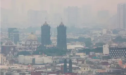  ??  ?? A view of Puebla, central Mexico, where authoritie­s are still looking for the man. Photograph: Jose Castanares/AFP/Getty Images