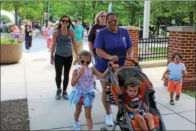  ?? DIGITAL FIRST MEDIA FILE PHOTO ?? Families and community members participat­e in The Mercury Mile walk. The weekly walk changes locations every week as different organizati­ons host the lunchtime activity.