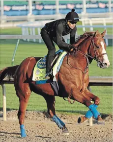  ?? CHARLIE RIEDEL THE ASSOCIATED PRESS ?? Kentucky Derby hopeful Justify runs during a morning workout at Churchill Downs Tuesday, May 1, in Louisville, Ky. The 144th running of the Kentucky Derby is scheduled for Saturday, May 5.