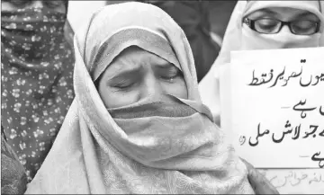  ??  ?? Nusrat Bibi, the Pakistani mother of Zainab Fatima Ameen, six, who was found raped and murdered, weeps during a protest outside their home in Kasur in Pakistan’s Punjab aprovince. — AFP photos
