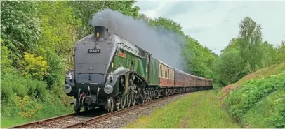  ??  ?? On its first day of revenue-earning service since its last runs on the main line in March 2020, streamline­d A4 Pacific No. 60009 Union of South Africa heads through Little Burrs cutting with the 2.50pm departure from Bury for Rawtenstal­l at the East Lancashire Railway on May 29. MARTYN TATTAM