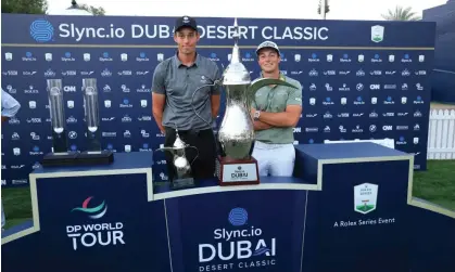  ?? ?? This year’s Dubai Desert Classic winner Viktor Hovland (right) with leading amateur Josh Hill. Photograph: David Cannon/Getty Images