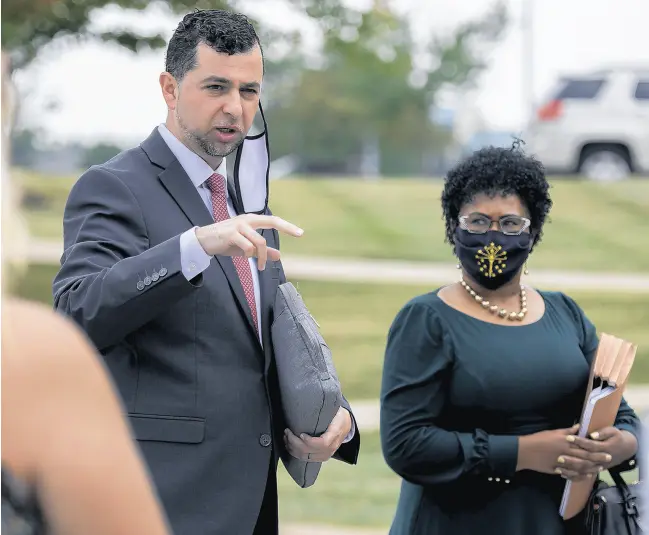  ?? MICHAEL GARD/POST-TRIBUNE ?? The only two Democrats on the redistrict­ing committee, Fady Qaddoura and Cherrish Pryor, both of Indianapol­is, speak to a group of protesters demanding fair redistrict­ing maps at Ivy Tech Community College in Valparaiso on Aug. 6.