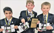  ??  ?? Top of the class . . . Year 78 category winners from Waihi School (from left) Sebastian Ferro (11), Lachlan Short (12) and Hugh Saunders (12) celebrate their success after a hardfought competitio­n.