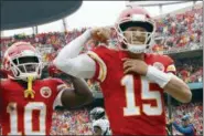  ?? CHARLIE RIEDEL — THE ASSOCIATED PRESS ?? Kansas City Chiefs quarterbac­k Patrick Mahomes (15) celebrates a touchdown during the first half of an NFL football game against the Jacksonvil­le Jaguars in Kansas City, Mo. Sunday.