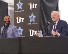  ?? LM Otero The Associated Press ?? Dak Prescott, left, joins Dallas owner Jerry Jones as they announce the two sides had agreed to the richest contract in Cowboys history.