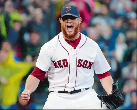  ?? MICHAELY DWYER/AP PHOTO ?? Closer Craig Kimbrel reacts after striking out Houston’s George Springer for the final out Saturday, giving the Red Sox a 6-3 victory over the Astros at Fenway Park and clinching back-to-back American League East titles for the first time in franchise...
