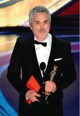  ??  ?? Alfonso Cuarón, Oscar du meilleur film étranger (et meilleure photograph­ie, et meilleur réalisateu­r) pour Roma en 2019