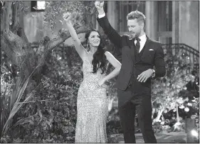  ??  ?? Arkansas’ Raven Gates teaches Nick Viall to call the Hogs on his season of ABC’s The Bachelor. Gates finished as runner-up and will look for love on Bachelor in Paradise.