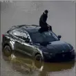  ?? Ohio Dept. of Transporta­tion ?? A person is seen stranded on his vehicle in floodwater­s Wednesday at I-270 and U.S. 23 in Columbus, Ohio. Officials said he drove past barricades and became stranded in high water.