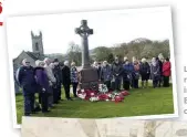  ??  ?? Left: relatives gather round the memorial in Fahan in 2017 Below: the officers of the Laurentic