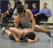  ?? AUSTIN HERTZOG - MEDIA NEWS GROUP ?? Pottstown’s Demond Thompson, top, controls Phoenixvil­le’s Jake Geiger Wednesday night at Pottstown. Thompson won by first period pin.