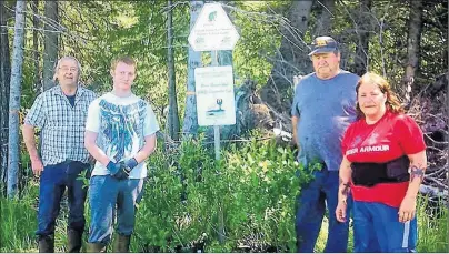  ?? SUBMITTED PHOTO ?? Lot 11 and Area Watershed Group staff members Wayne Lynch, left; Lance Hardy, Grant Lynch and April Annand planted trees and shrubs along the Enmore River in June 2017.