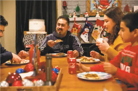  ?? Photos by Brittany Hosea- Small / Special to The Chronicle ?? Jorge Magana de Cuevas ( center) and his wife were hospitaliz­ed for several days after contractin­g COVID19, severely impacting the family’s income.