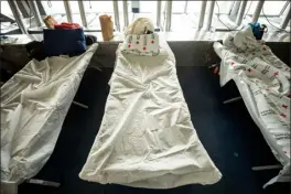  ?? ?? Cots are set up in an emergency shelter for people arriving from the southern U.S. border, set up at a Denver recreation center in December 2022.