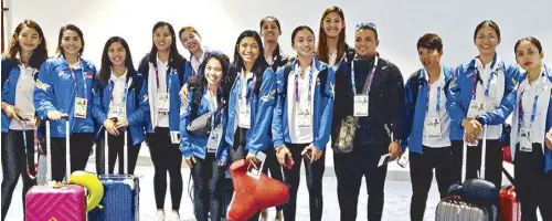  ?? JOEY MENDOZA ?? Phl volleybell­es, led by skipper Aby Maraño (second from left) pose upon arrival at the Indonesian capital Friday, weary from the grueling training in Japan but upbeat of their quarterfin­al chances in the 18th Asian Games beginning tomorrow.