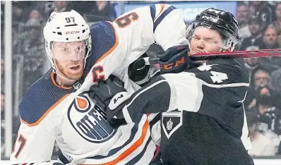  ?? MARK J. TERRILL
THE ASSOCIATED PRESS ?? Oilers centre Connor McDavid, left, and Kings defenceman Mikey Anderson battle during Game 6 of their playoff series on Thursday.