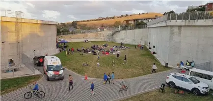  ??  ?? Huntsbury residents gather for a movie night and party in the rebuilt Huntsbury Reservoir last year. The old reservoir was Christchur­ch’s principal drinking water storage facility and broke open in the 2011 earthquake.