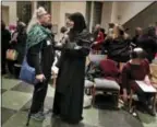  ?? JULIE JACOBSON — THE ASSOCIATED PRESS ?? On Feb. 16, members of the Sisterhood Salaam Shalom talk after a unity vigil held at the Jewish Theologica­l Seminary in New York.