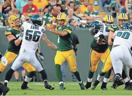  ??  ?? Green Bay Packers quarterbac­k Brett Hundley looks to pass against the Philadelph­ia Eagles last Thursday at Lambeau Field.