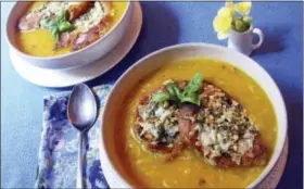  ?? SARA MOULTON VIA AP ?? This photo shows butternut squash and leek soup with gruyere pesto toast in New York. This dish is from a recipe by Sara Moulton.