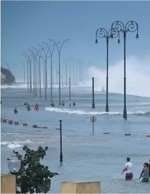  ??  ?? Havana’s sea wall was no match for the powerful waves whipped up by Hurricane e