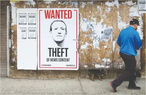  ?? David Bloom / Postmedia news files ?? A poster featuring an image of Facebook co-founder Mark Zuckerberg, near 97 Street and Jasper Avenue, in Edmonton.