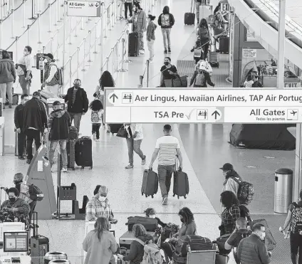  ?? Angus Mordant / Bloomberg ?? Airports for major cities are still serving far fewer travelers than they did early last year. At Kennedy Airport in New York, passenger volume is about one-third of what it was. San Francisco Internatio­nal is serving a quarter of its typical volume.