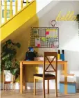  ?? ?? Turn space under the stairs into a family-friendly shared workstatio­n and energise the area with a cheerful yellow wall and bright stationery Milton dining table in Natural Oak, £179.99; Kendal chair,
£59.99, both Furniture And Choice