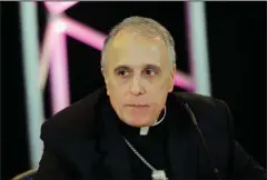  ?? The Associated Press ?? GROWING CRISIS: In this Nov. 15, 2016, file photo, Cardinal Daniel DiNardo of the Archdioces­e of Galveston-Houston, the newly-elected president of the United States Conference of Catholic Bishops, speaks at a news conference at the USCCB’s annual fall meeting in Baltimore. As U.S. Catholic leaders head to the Vatican to meet Pope Francis about a growing church abuse crisis, the cardinal leading the delegation, DiNardo, has been accused by multiple victims of not doing enough to stop a priest who was arrested this week on sexual abuse charges.