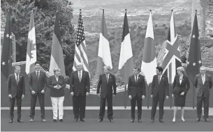  ?? MIGUEL MEDINA, AFP/GETTY IMAGES ?? President Trump and other G-7 members are welcomed to Taormina, Italy, on Friday.