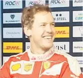  ?? CRAIG DAVIS/STAFF ?? “I’ve raced in a baseball stadium before I’ve seen a baseball game,” Sebastian Vettel said.