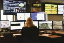  ?? AP PHOTO/LISA MARIE PANE ?? A dispatcher works at a desk station Tuesday with a variety of screens used by those who take 911 emergency calls in Roswell, Ga.